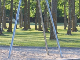Swings, under the shade of the trees at Point Park in Fort Frances